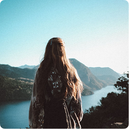 Kalu Corrales overlooking a mountain lake