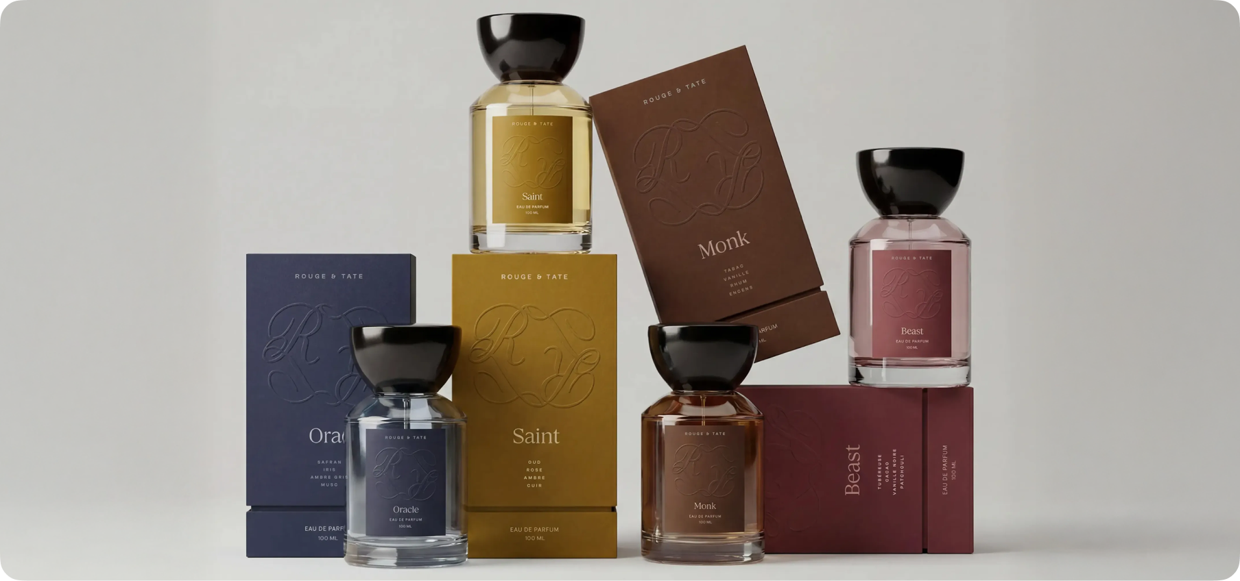 The full Rouge & Tate fragrance collection — four archetype scents unified by one coherent packaging system and art direction