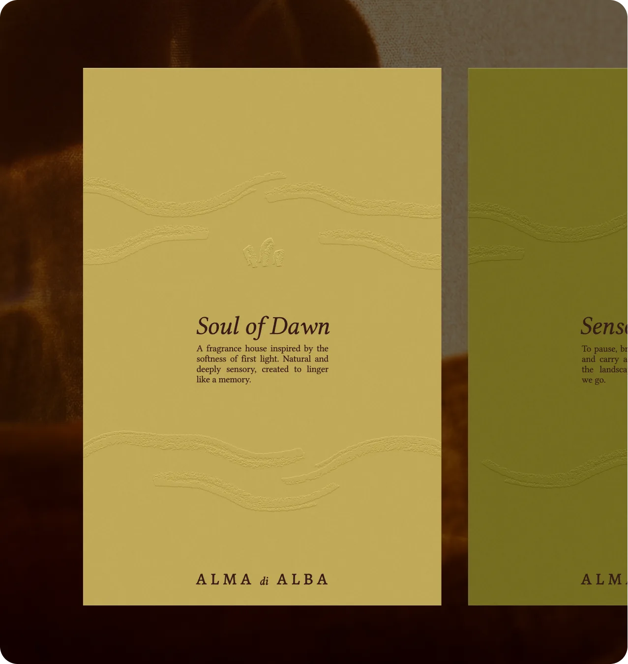 Alma di Alba — printed 'Soul of Dawn' card mockup on textured yellow stock with embossed brush strokes