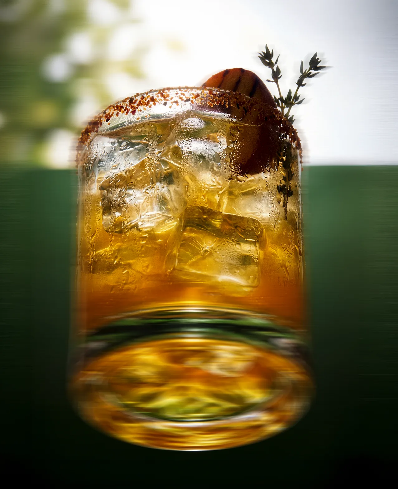 Verdadero — a tall cocktail over ice with a rosemary sprig