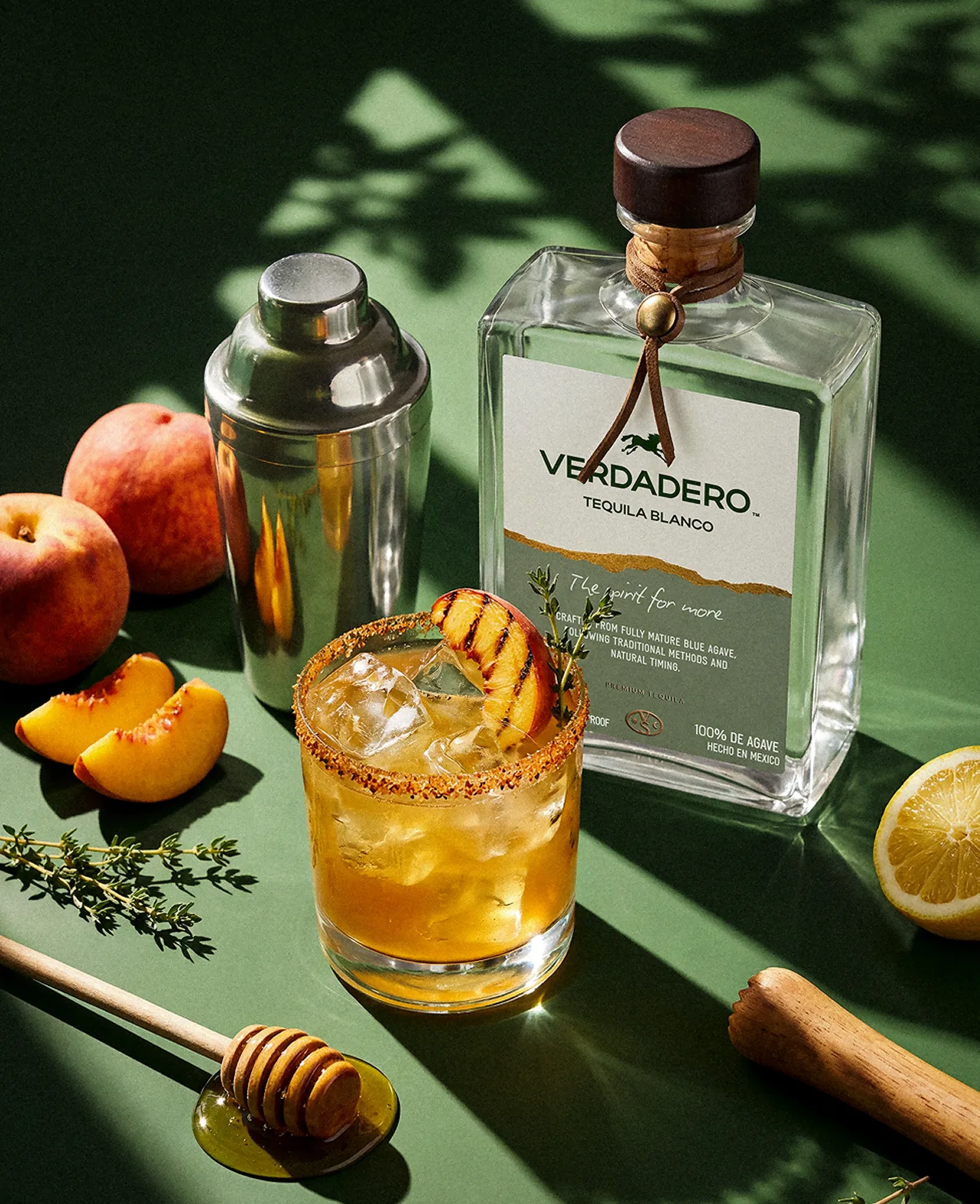 Verdadero — a cocktail and shaker on a deep green set
