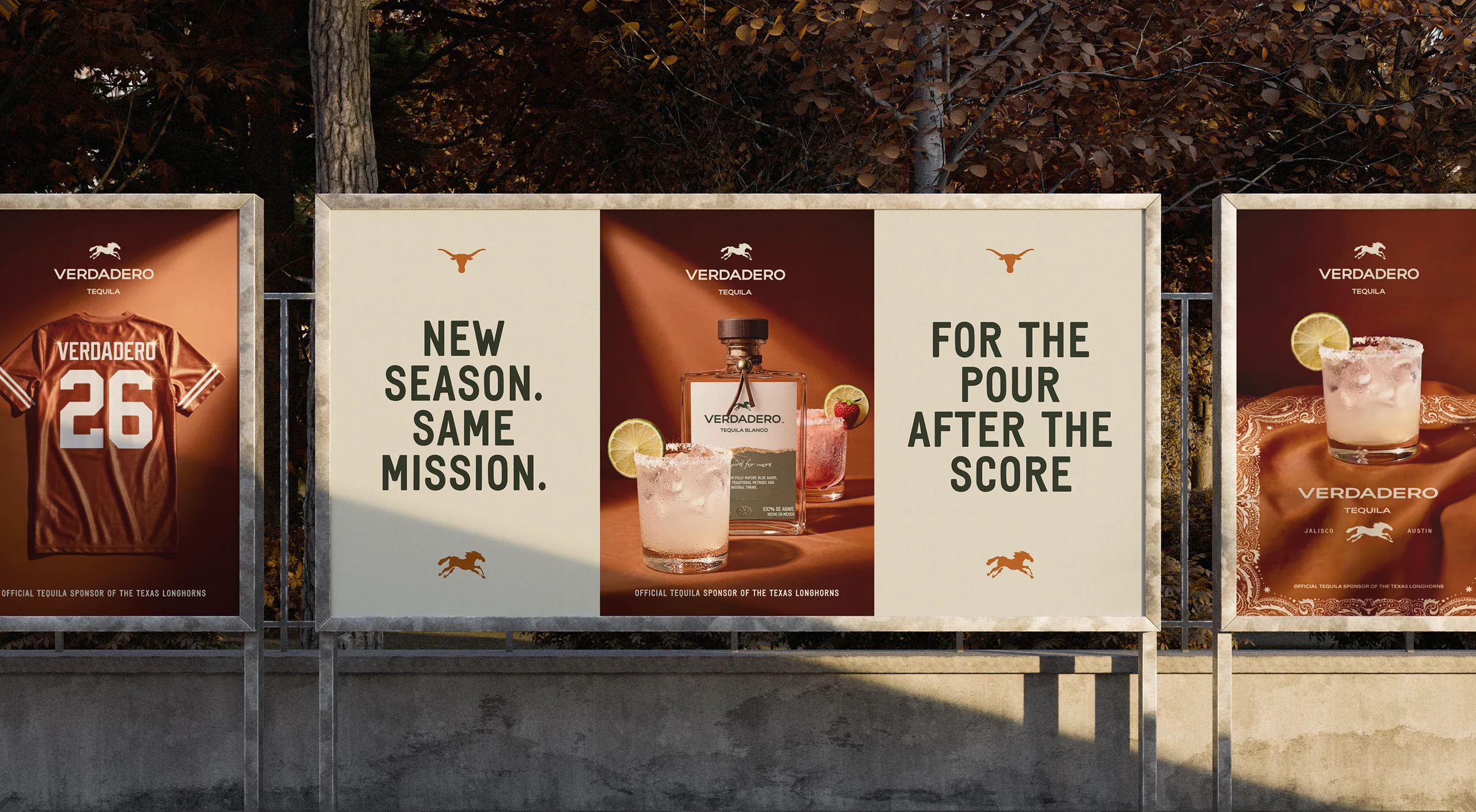 Verdadero — outdoor campaign panels reading 'New season. Same mission.' and 'For the pour after the score,' with the Verdadero 26 jersey and signature cocktails