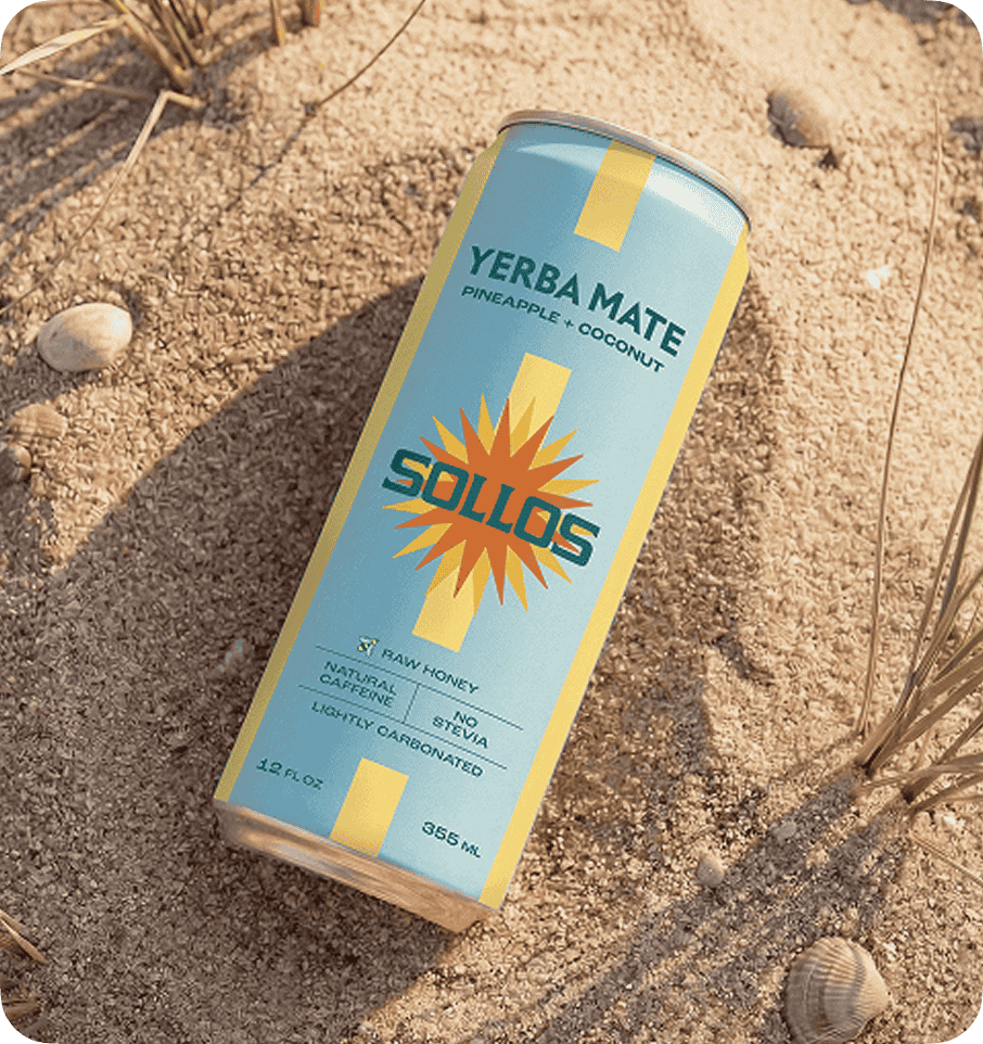 Sollos Yerba Mate can in beach setting, brand identity designed by CreativeWise